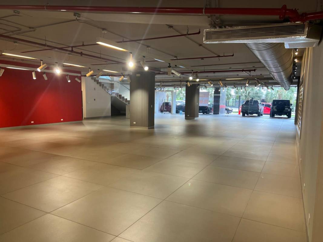 Large tiled commercial space with exposed ductwork and track lighting at PH Samuel Lewis Plaza Obarrio Panama