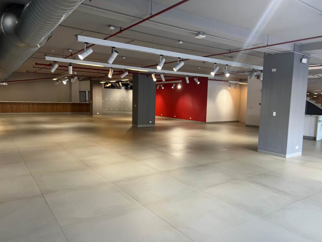 Open plan commercial interior with modern tile flooring exposed ceiling and red accent wall PH Samuel Lewis Plaza Panama