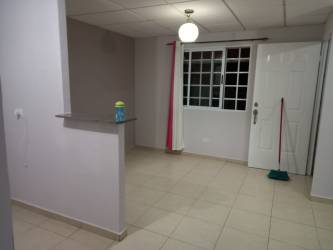 Compact kitchen area with breakfast bar and open living space in Corotú house Vacamonte Panama