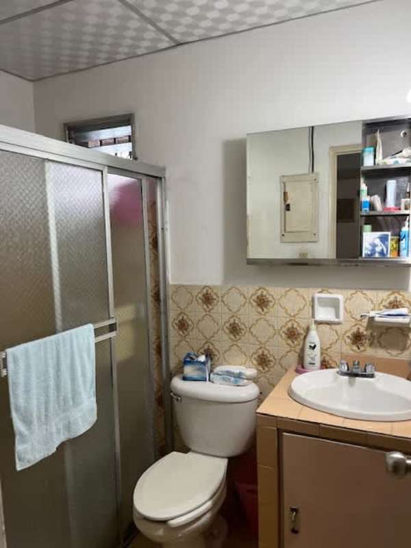 Bathroom with sliding shower glass door vanity and mirror Villa de las Fuentes