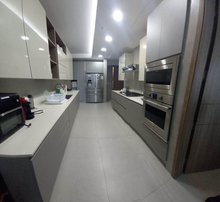 Dining area with contemporary furnishings and Pacific Ocean view at Q Tower Punta Pacifica Panama