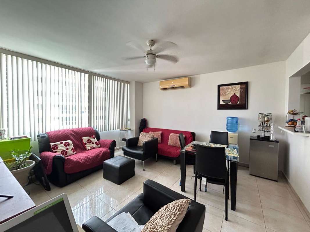 Living area with large windows, dining space and kitchen pass-through PH Vivendi Towers Edison Park