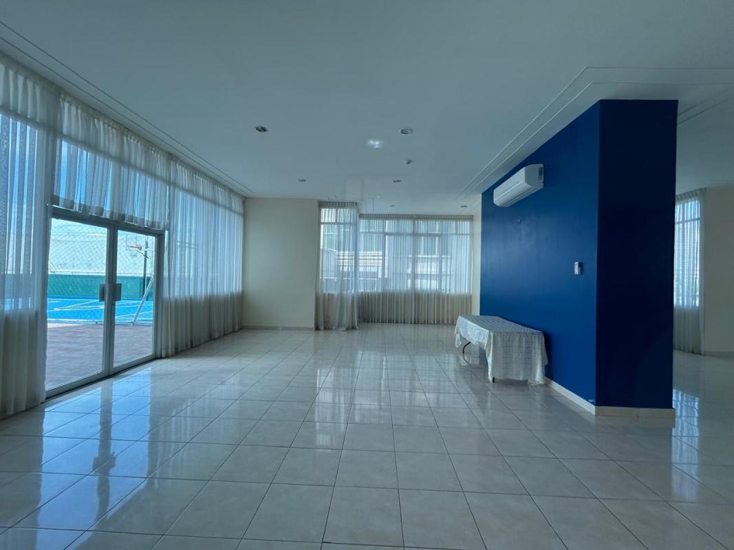 Modern gym with cardio, weight equipment and mirrors at PH Vivendi Towers