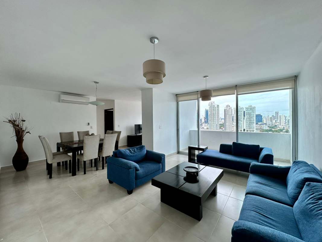 Open living dining room with balcony access, city skyline views in PH San Francisco Bay Panama City