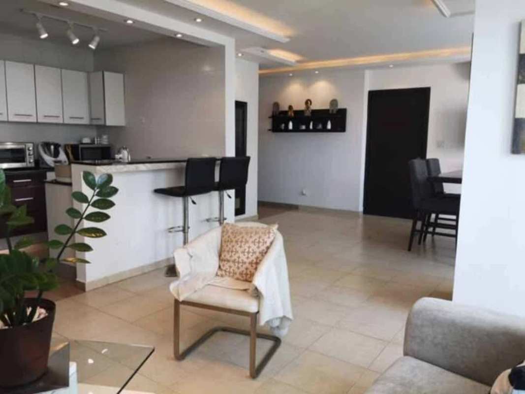 Open concept kitchen with granite counters, dining area, modern lighting in Bayfront Tower Panama