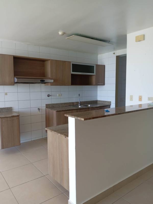 Modern open kitchen area with breakfast bar and granite countertops PH Villa de las Fuentes Panama