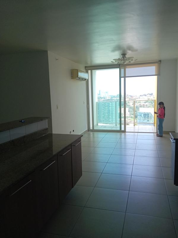 Bright living dining room with large windows and balcony city views at PH Villa de las Fuentes Tower Panama