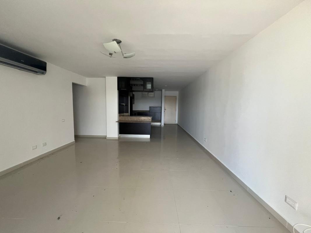 Spacious modern kitchen with granite countertops and dark cabinetry at PH Altamira Gardens Panama