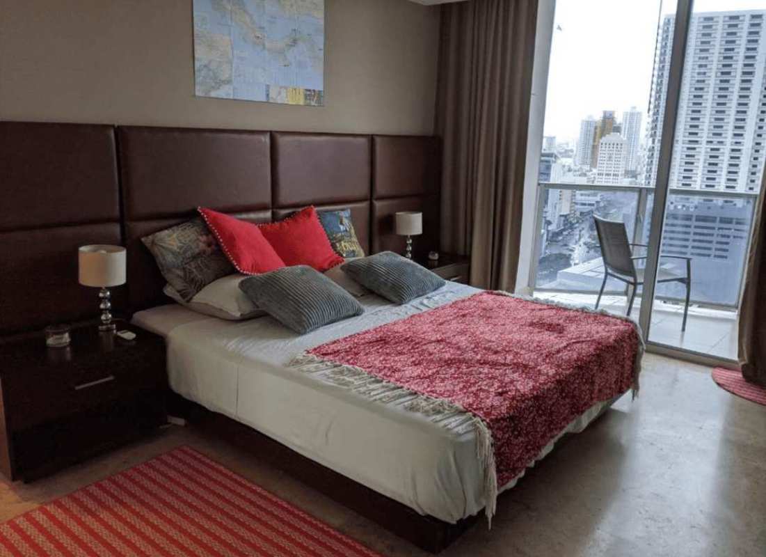 Elegant master bedroom with large windows in Marbella Tower Panama City