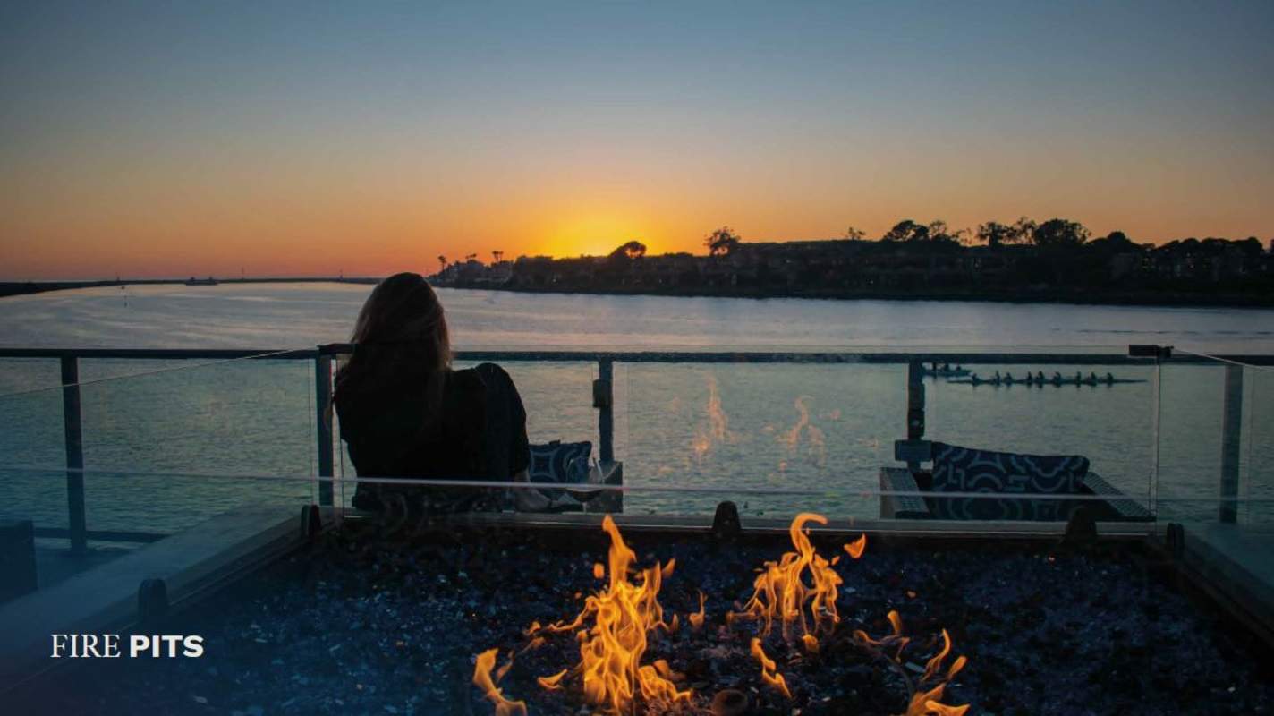 Modern waterfront terrace with firepit seating at sunset in PH Ipanema Costa del Este Panama