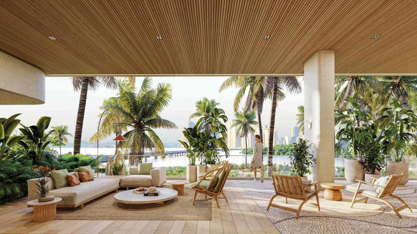 Luxurious outdoor lounge terrace with tropical views of ocean and city skyline in PH Ipanema Panama