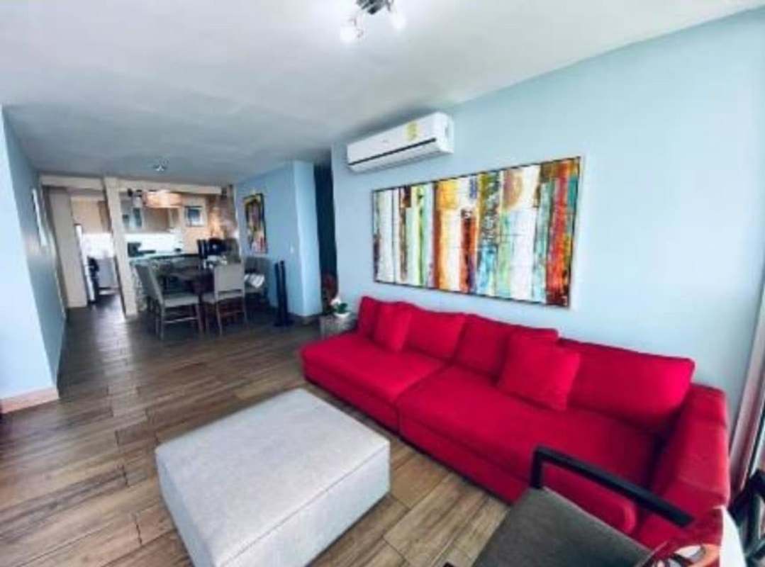 Spacious furnished living room with red and blue accents San Francisco Bay City Panama