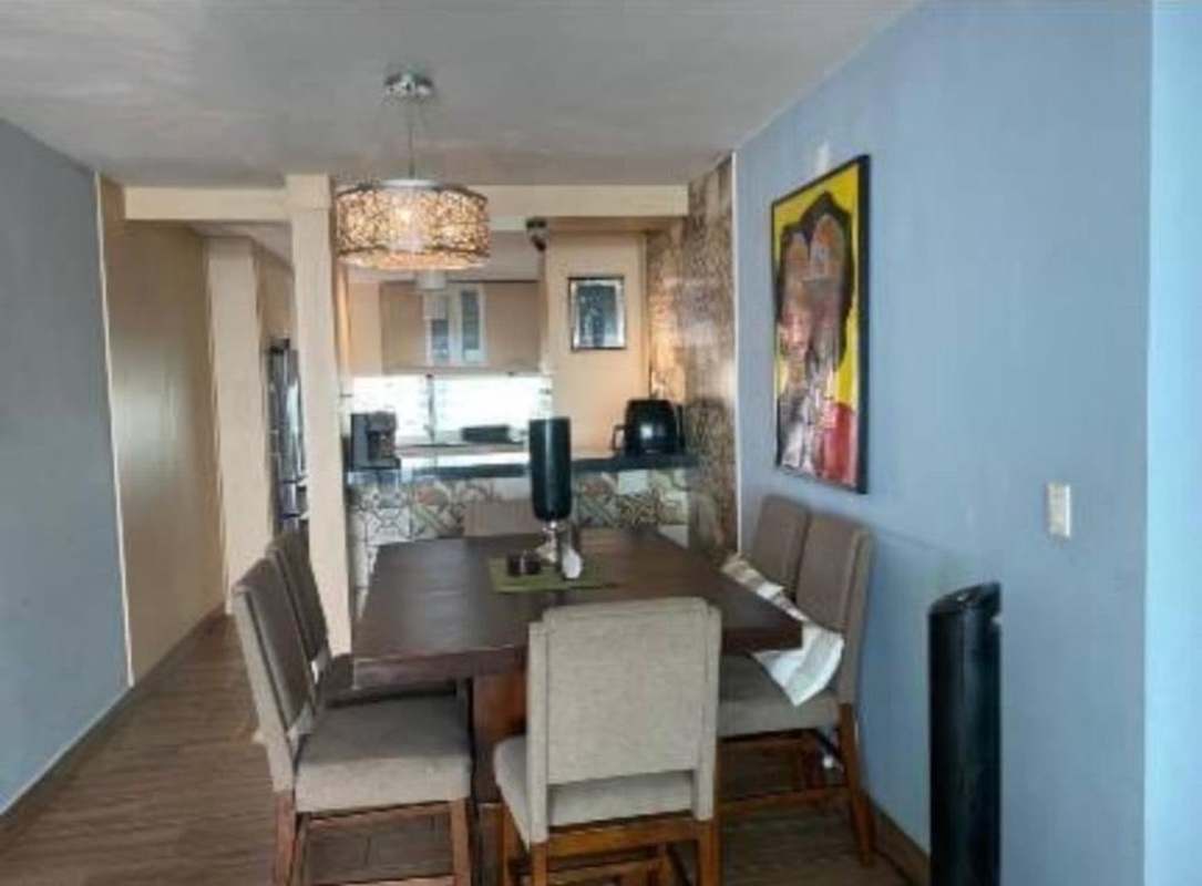 Contemporary dining space adjacent to open kitchen with colorful backsplash in PH San Francisco Bay Panama