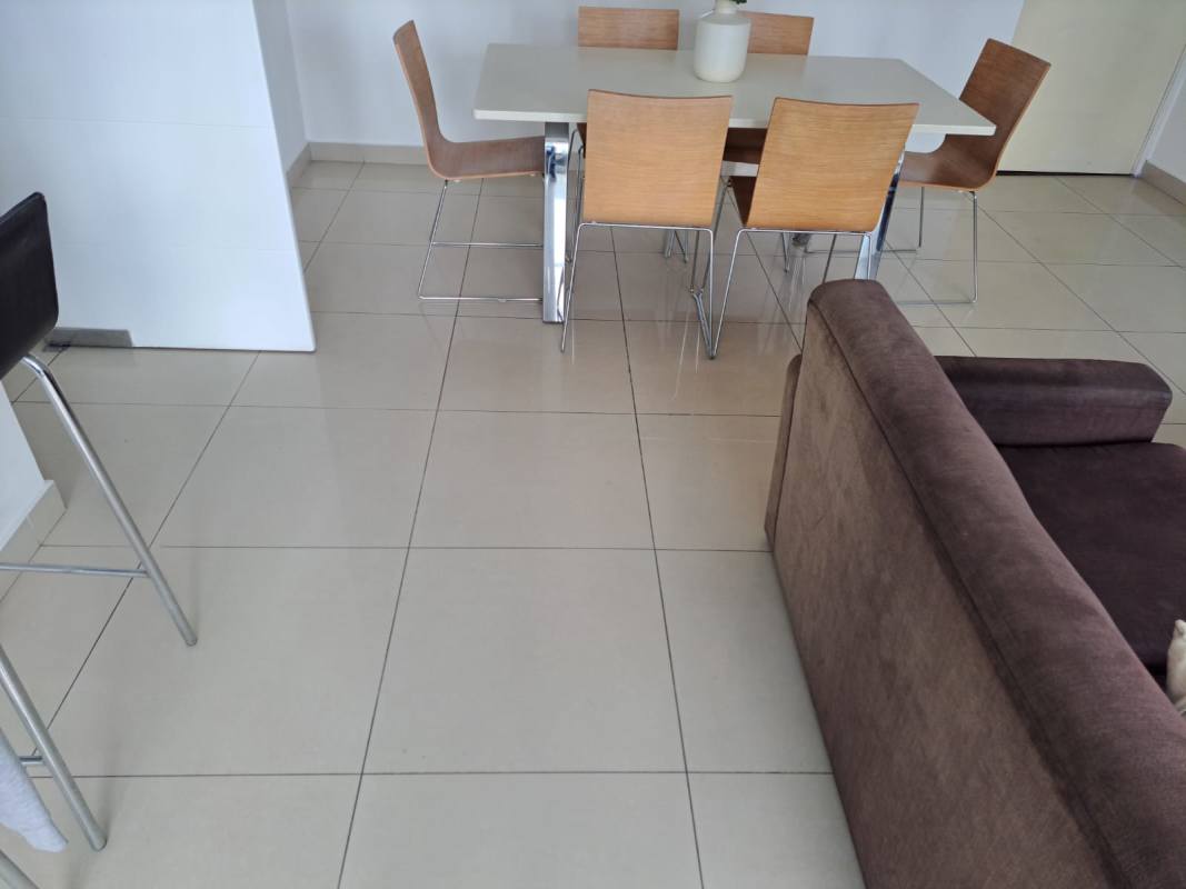 Dining area with modern furniture open to living space in PH Costa del Este Park