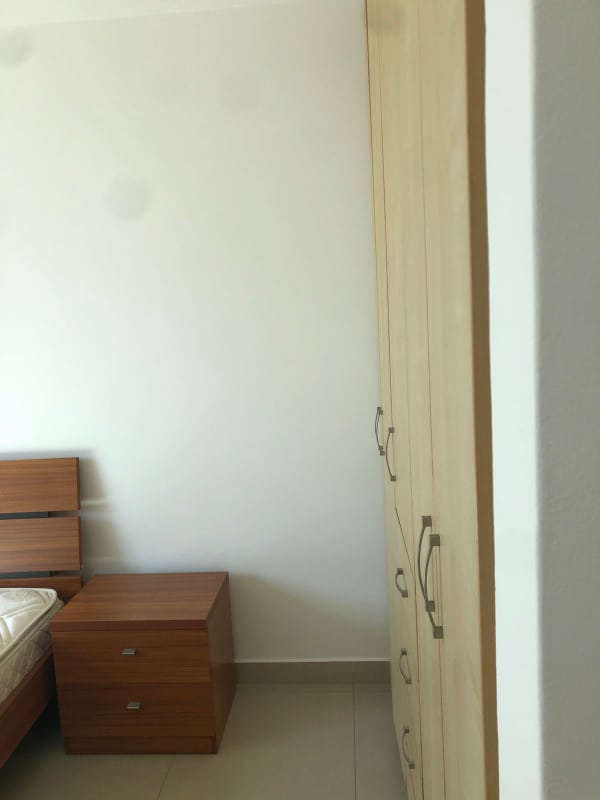 Fully equipped kitchen with granite countertops, wood cabinets in Costa del Este apartment Panama