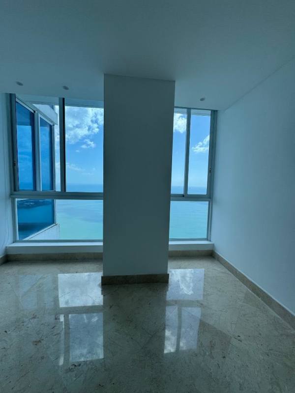 Modern gourmet kitchen with granite island and stainless appliances in The Point Tower Punta Paitilla