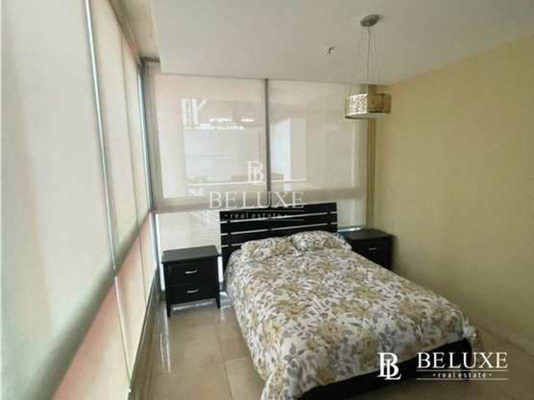 Bright living room with floor-to-ceiling glass and ocean panorama in PH Villa del Mar Panama City