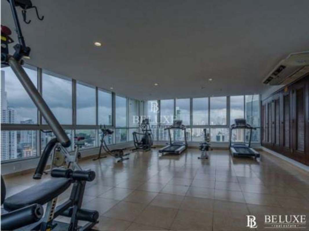 Fully equipped gym with city skyline views, natural light PH Villa del Mar Panama