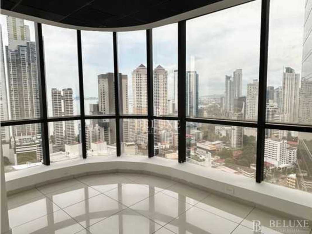 Small office kitchenette area with cabinetry and city view PH Plaza Banco General