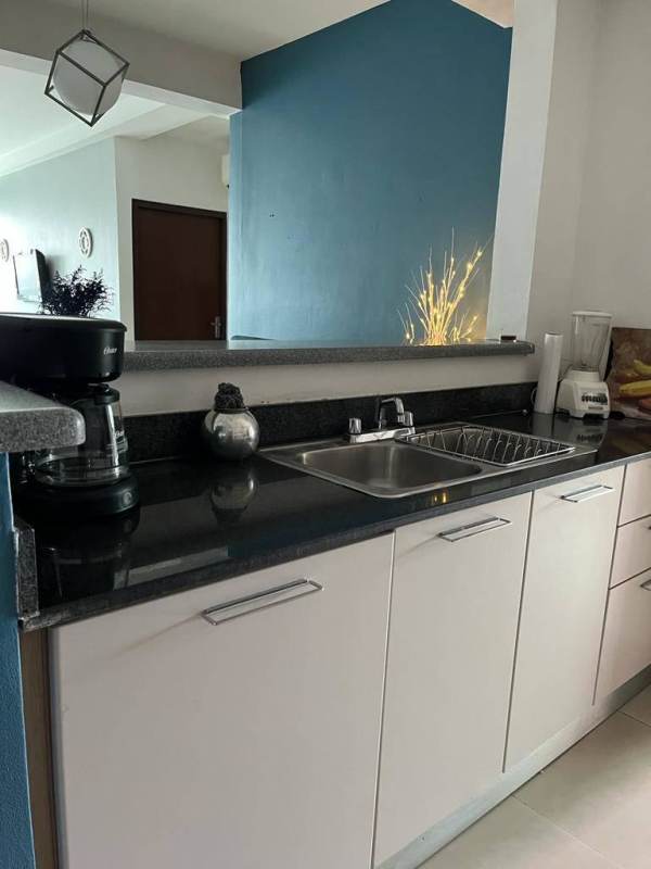 Modern bathroom with glass sink and walk-in shower in Edificio Mirador del Golf Panama