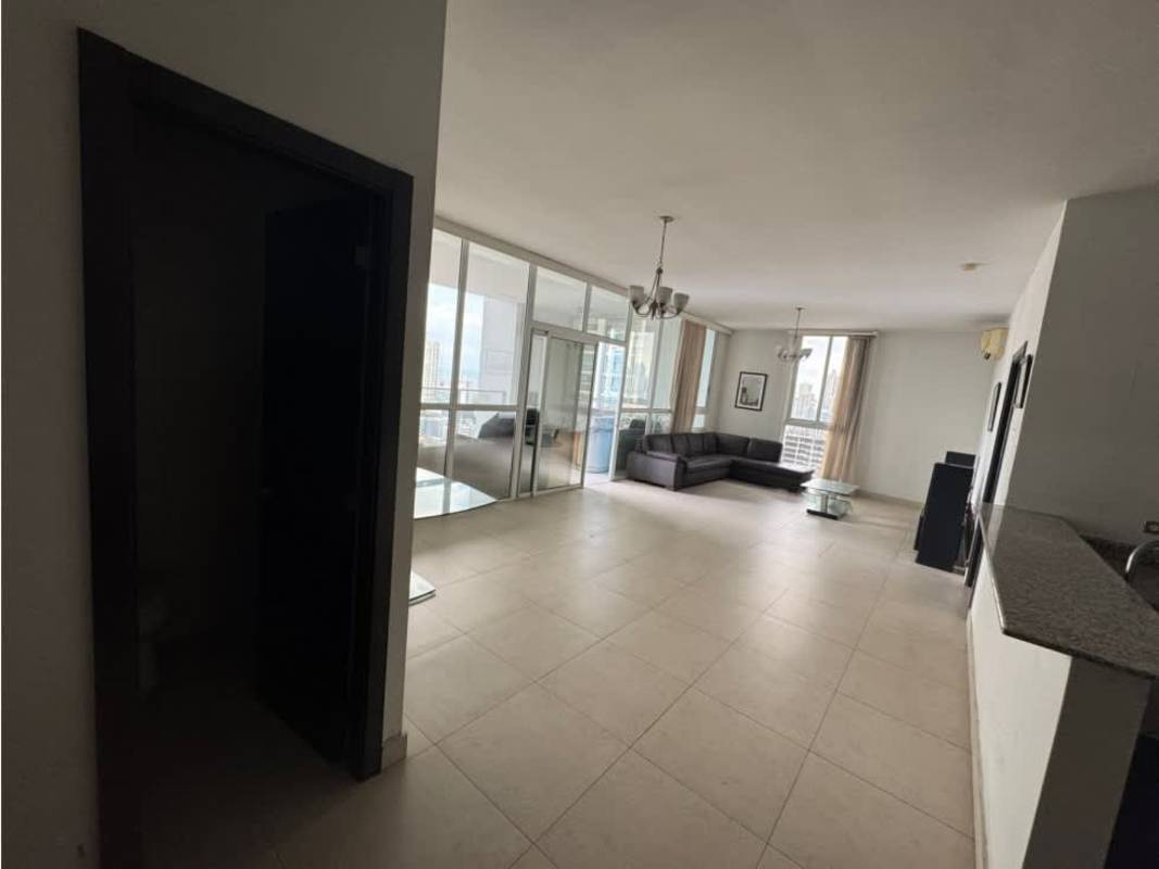 Living room with sectional sofa, large windows and terrace access PH Quadrat Panama City