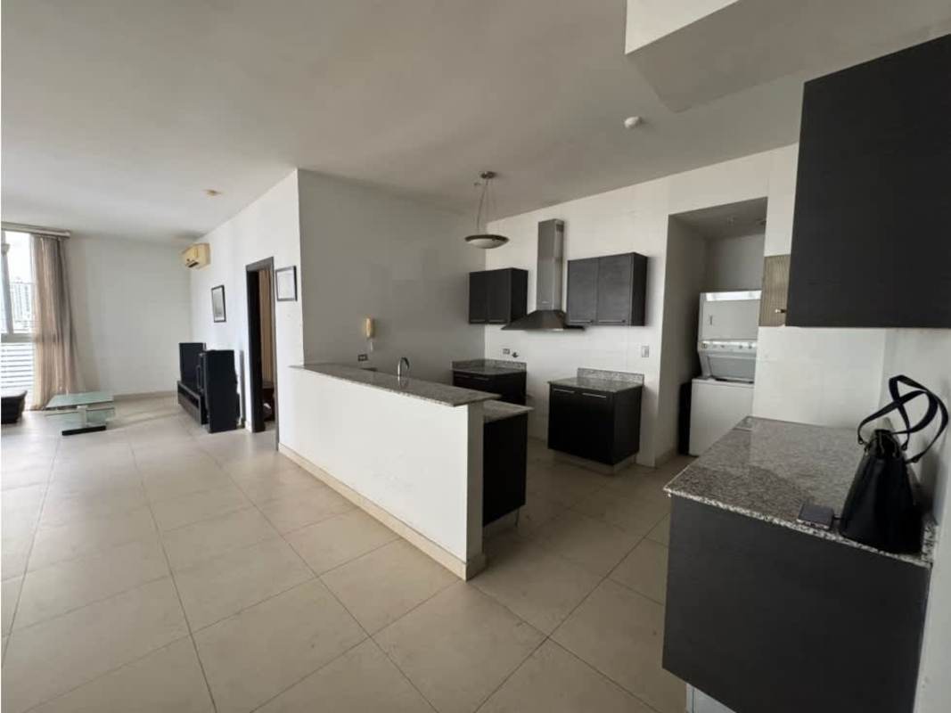 Open plan kitchen with granite counters, dark wood cabinets PH Quadrat San Francisco Panama