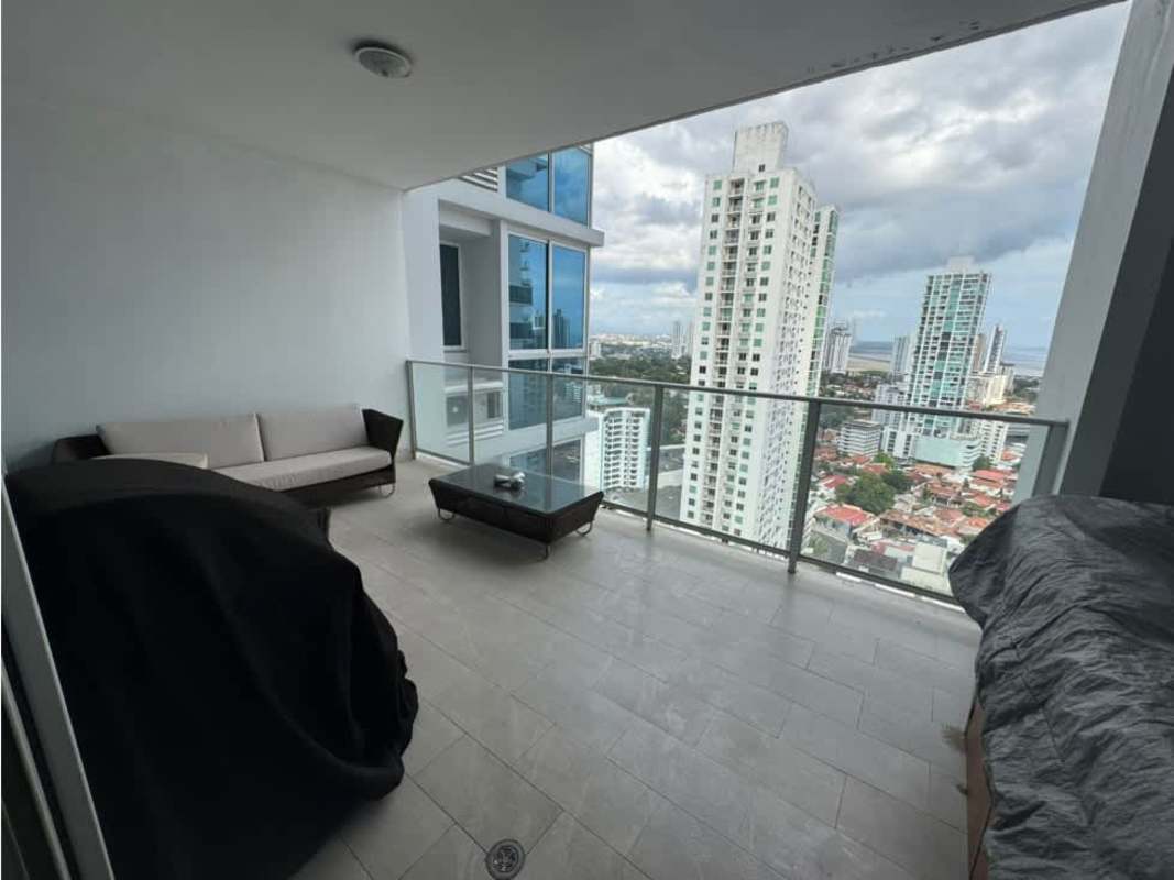 Terrace balcony with glass railing, jacuzzi, outdoor furniture overlooking city in PH Quadrat Panama