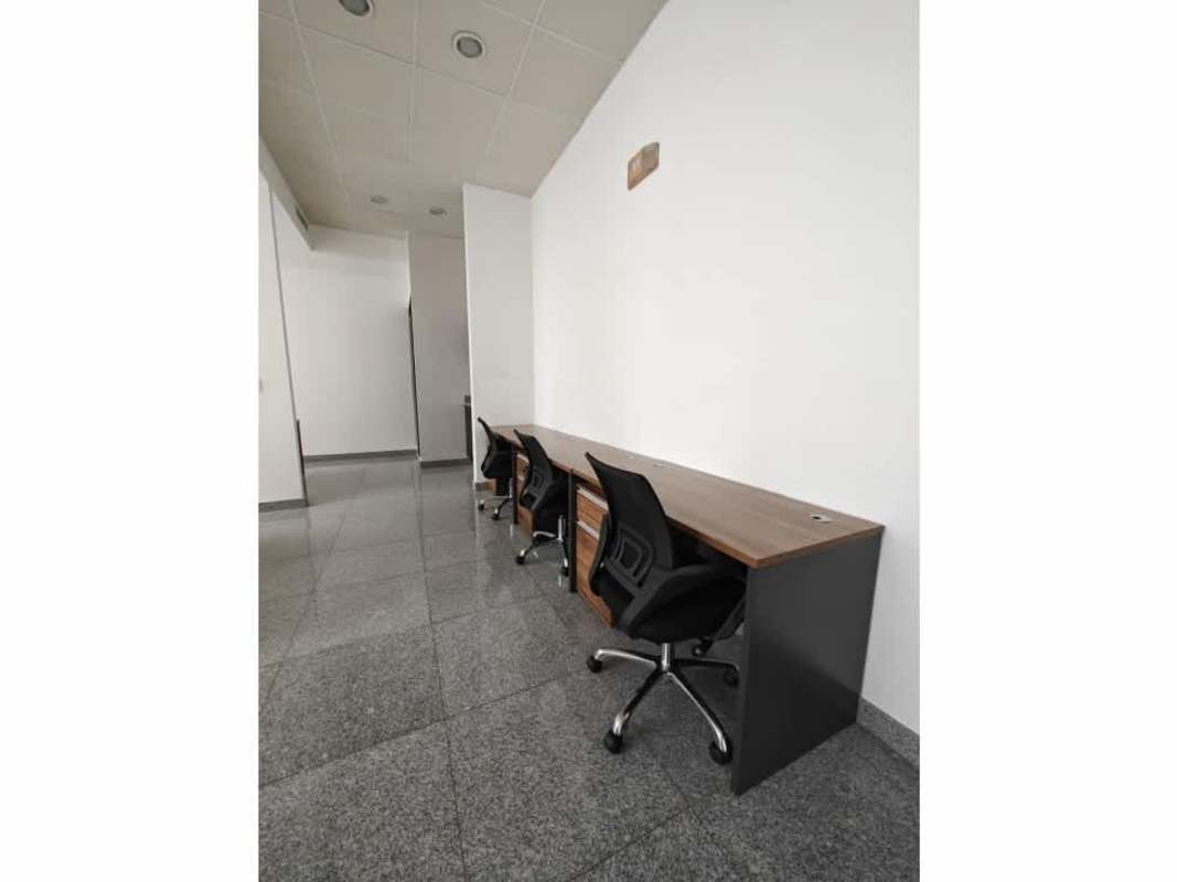 Workspace with long desk, office chairs, minimalist design at PH Financial Park Tower Bella Vista Panama