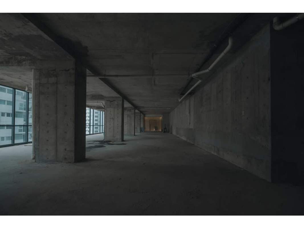 Entrance area with valet parking sign in front of Nuovo by Armani Casa high-rise in Panama City