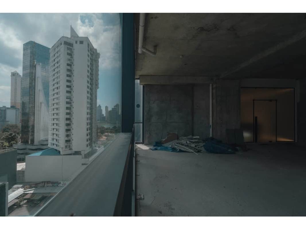 Minimalist reception area with glass divider in Nuovo by Armani Casa Panama