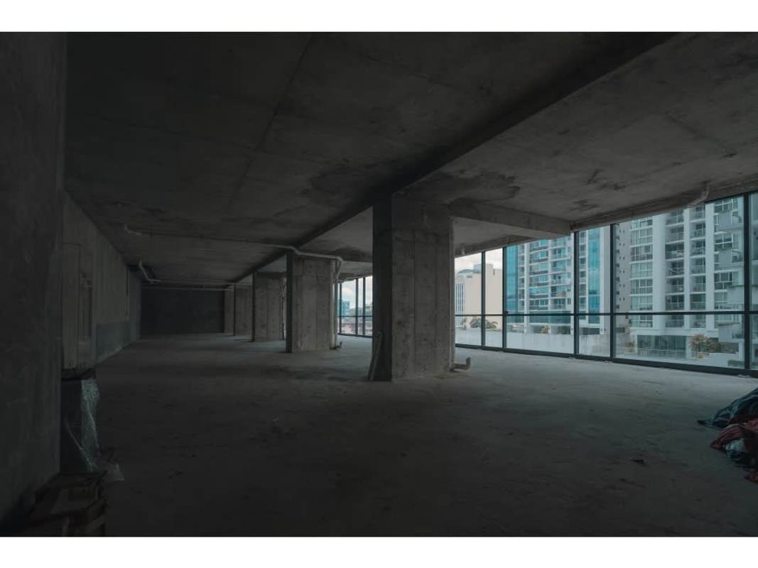 Unfinished commercial office with floor-to-ceiling windows overlooking Panama City at The Plaza Nuovo Armani