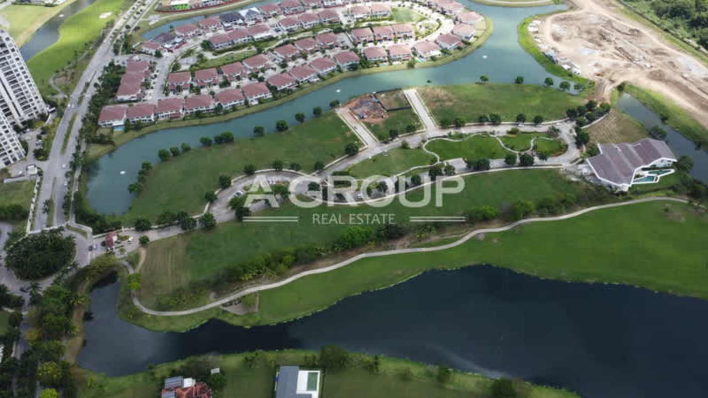 Aerial lake and golf course with high-rise and houses in Peninsula Estates Santa Maria Panama City
