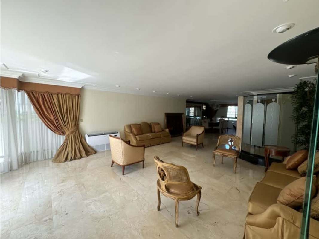 Modern bathroom with double sinks, marble finishes and glass shower at PH Diplomático Obarrio Panama