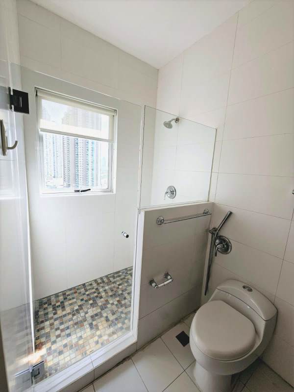 Luxury master suite with marble floors and balcony overlooking Pacific Ocean Q Tower Panama