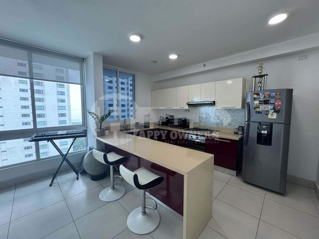 Contemporary open kitchen with granite countertop and stainless appliances PH Castellammare Costa del Este