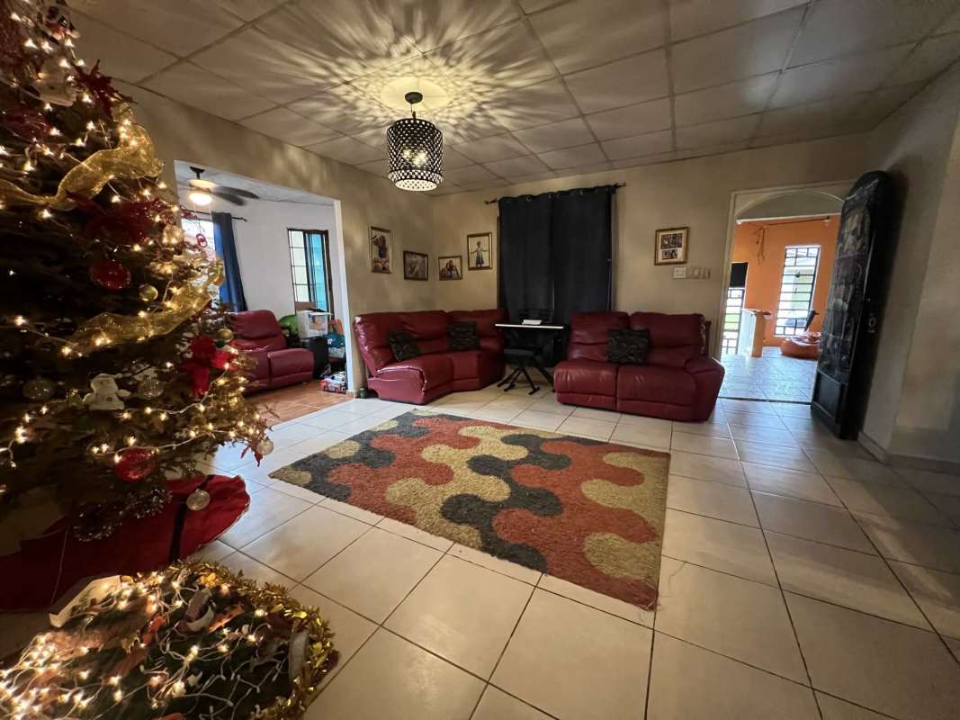 Bedroom with split AC, double closet, colourful decor in Panama family home for sale