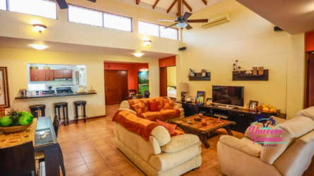 Private swimming pool with sun deck and lush landscaping at Costa Blanca Golf & Villas Panama