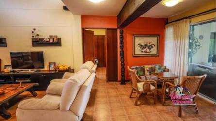 Large open-plan living dining area with ceiling fans and garden access in Costa Blanca Golf Villas Panama