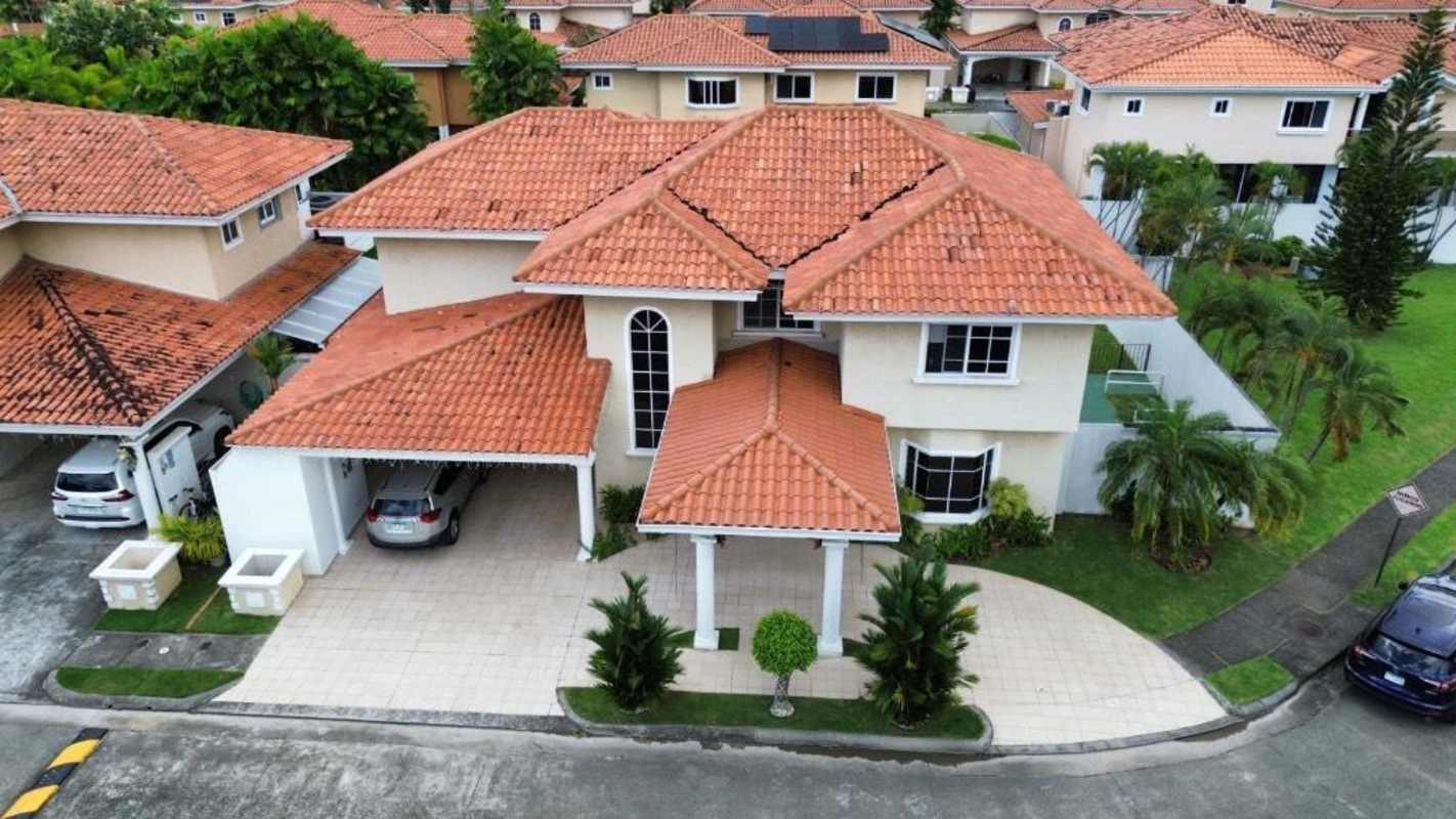 Mediterranean two-story house with covered garage, landscaped front yard in Palmeras del Este Costa del Este Panama