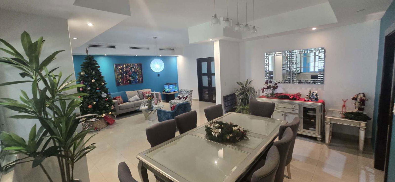 Kitchen in Palmeras del Este house with built-in oven, microwave, gas stove, dining area and garden view Costa del Este Panama