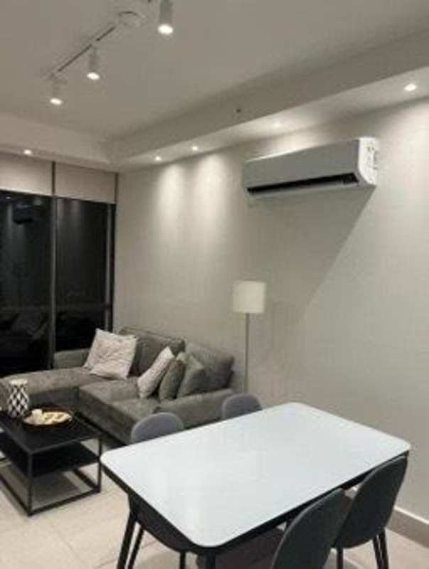 Modern furnished living room with sofa, dining table, balcony sea views at PH Coco Place Coco del Mar Panama