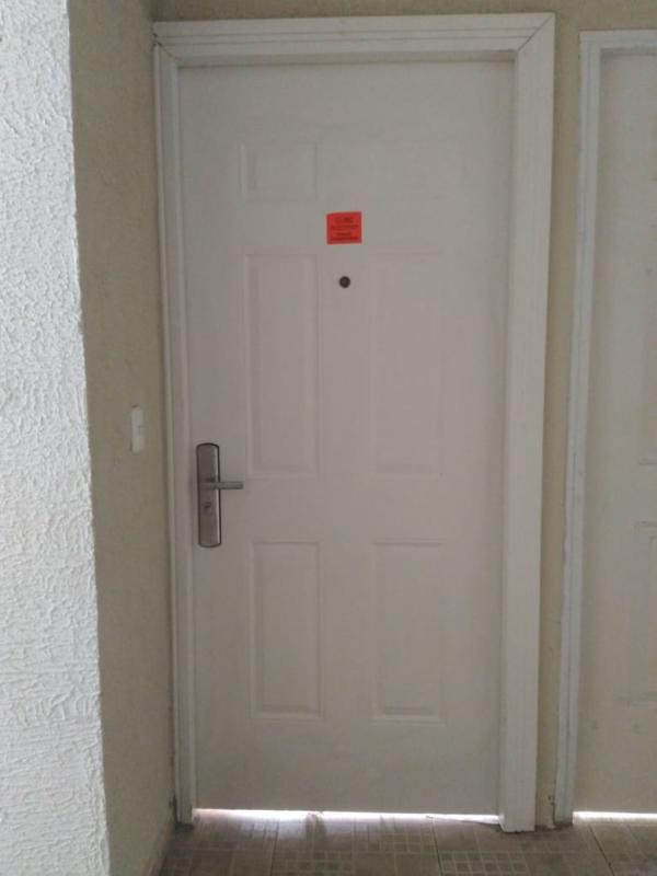 White hallway with bright light beige tiled floor in PH Balcones de Santa Fe Pacora Panama