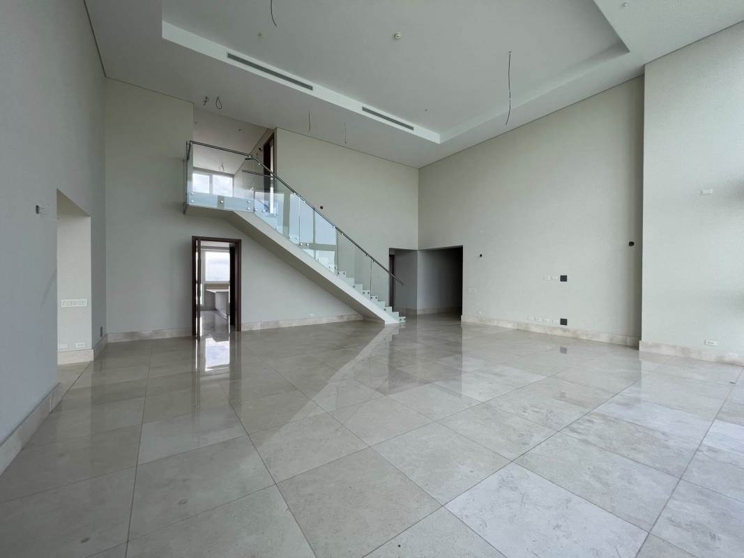 Bright double-height living room with panoramic ocean view at PH Windrose Coco del Mar