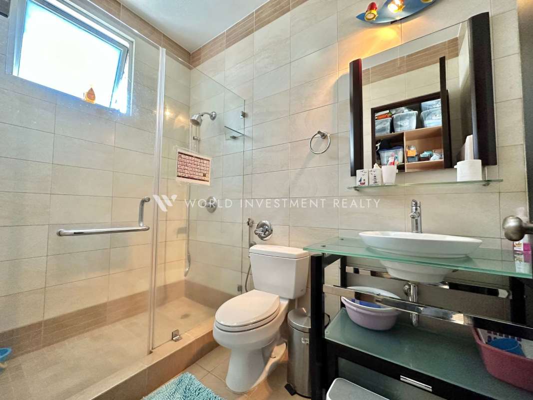 Large ensuite bedroom with floor to ceiling windows and Pacific view Punta Pacifica Panama