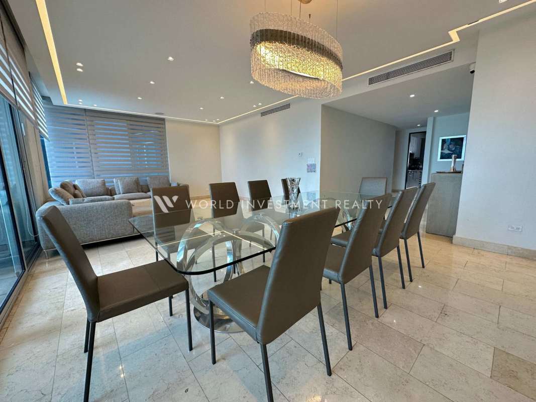 Guest bedroom with ensuite bath, city skyline view, marble floors Panama City