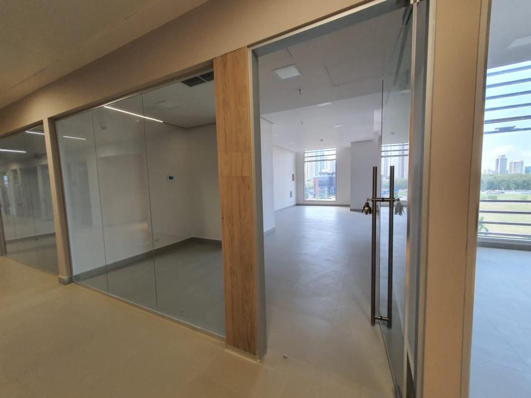 Open office layout with large glass walls and panoramic city views at Town Center Panama