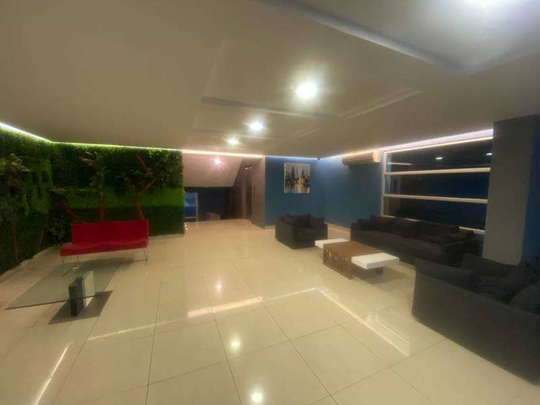 Lobby lounge area with green wall and seating PH Famagosta Loft Panama City