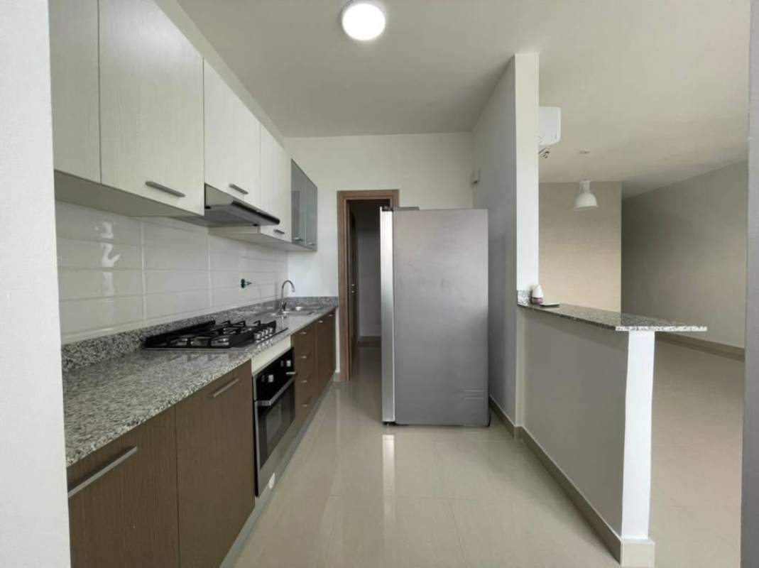 Bright modern kitchen with granite counters and full appliances PH Roma Panama City