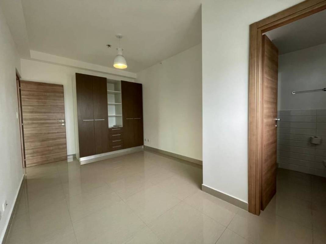 Bright apartment interior with balcony access and natural light in PH Roma Panama for sale