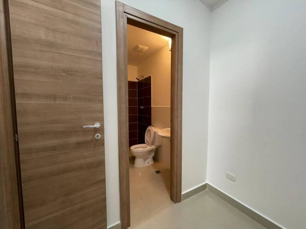 Interior compact bathroom with stack washer/dryer and modern finishes PH Roma Panama